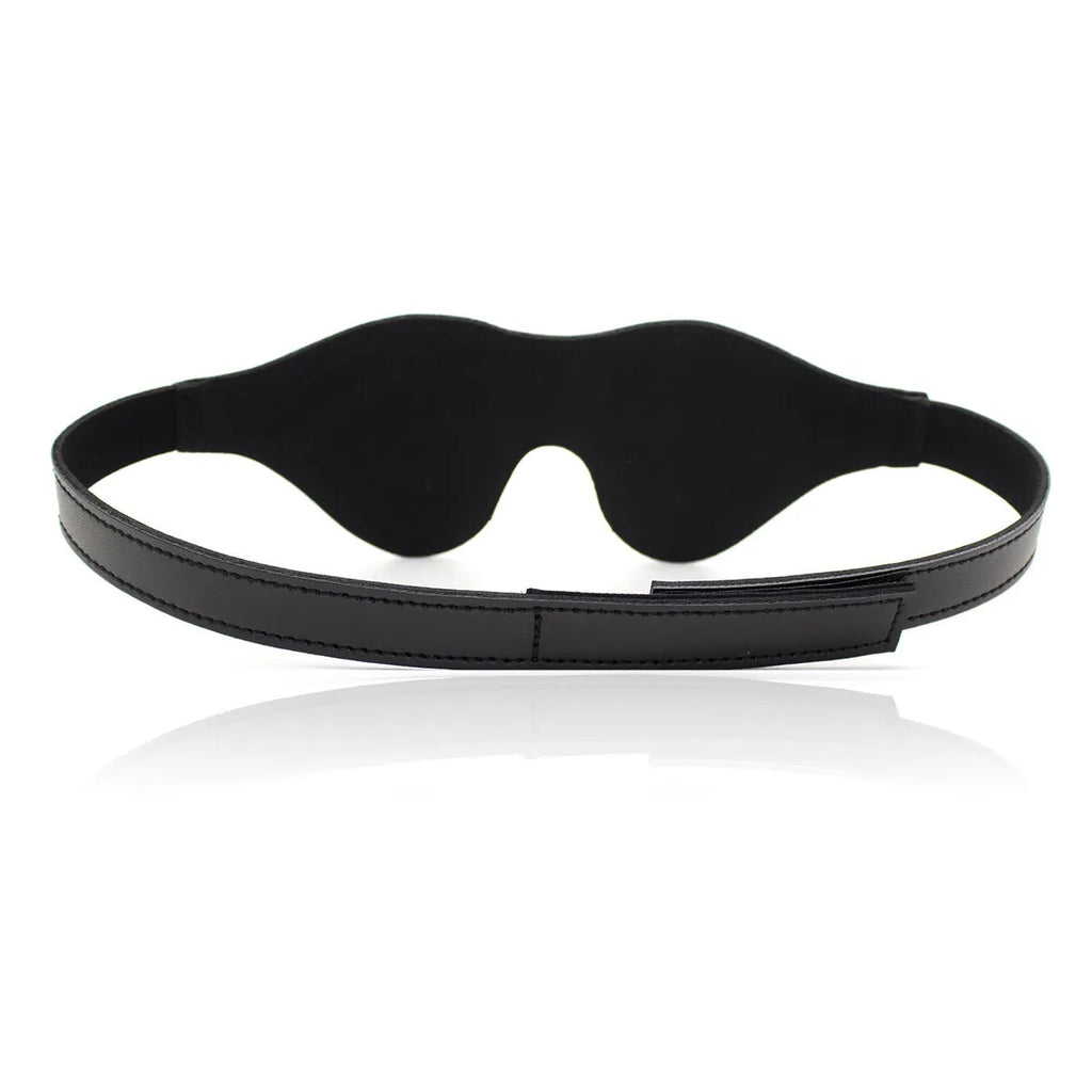 Women's black leather velcro eye mask blindfold showing three-dimensional shape and metal hardware.