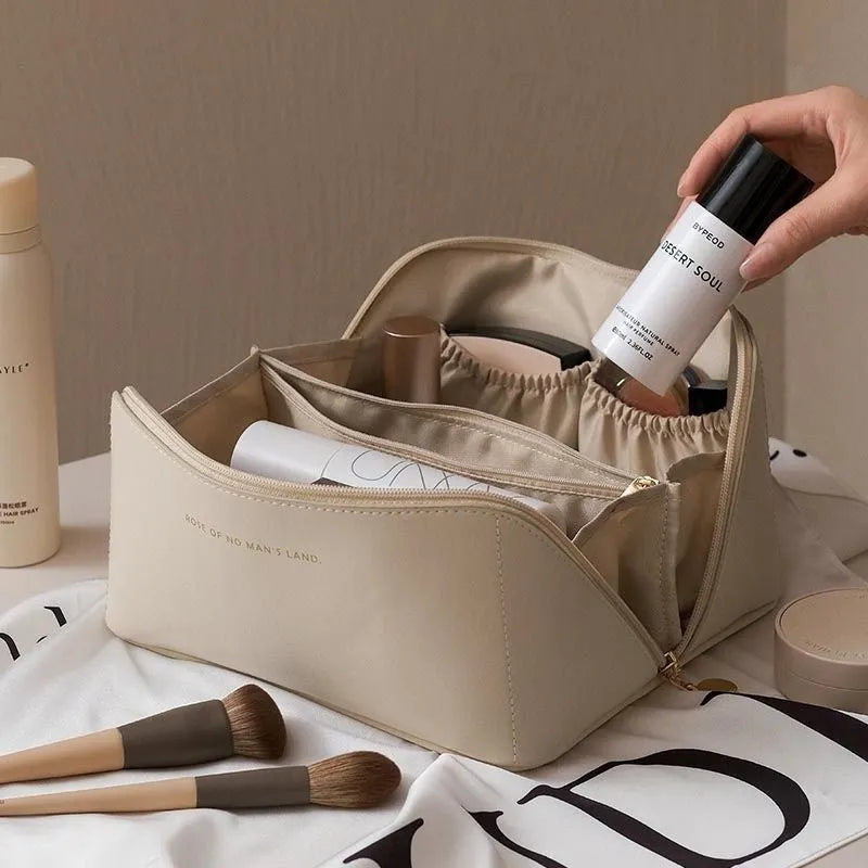 Large capacity travel makeup storage bag in brown PU leather with solid colour finish on white background