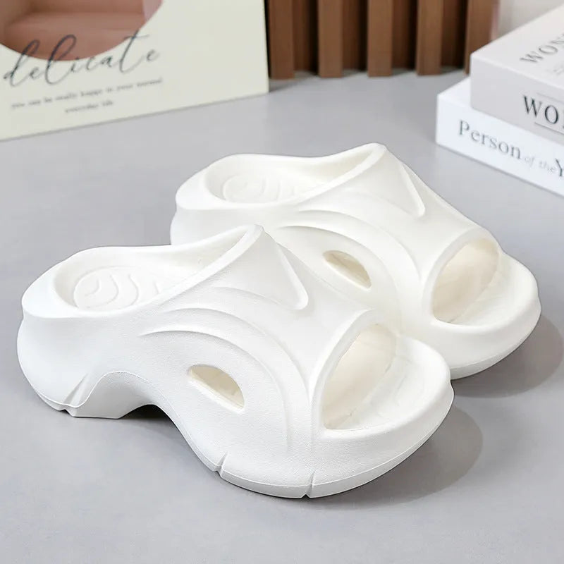 Women's thick-soled EVA beach slippers in white, black, and rose red colours with round toe design