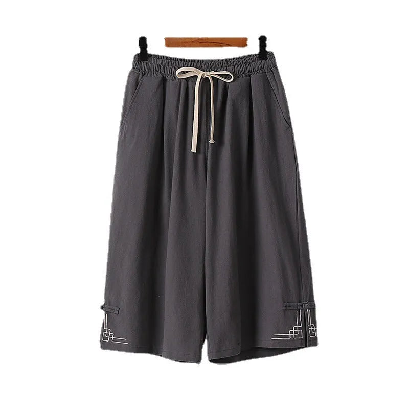 Women's wide leg linen leisure shorts in apricot colour with embroidery detail.