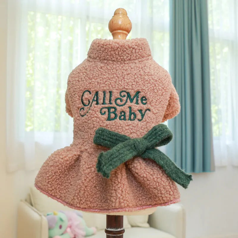 Dog wearing pink fleece skirt with baby letter pattern, Berber fleece pet clothing