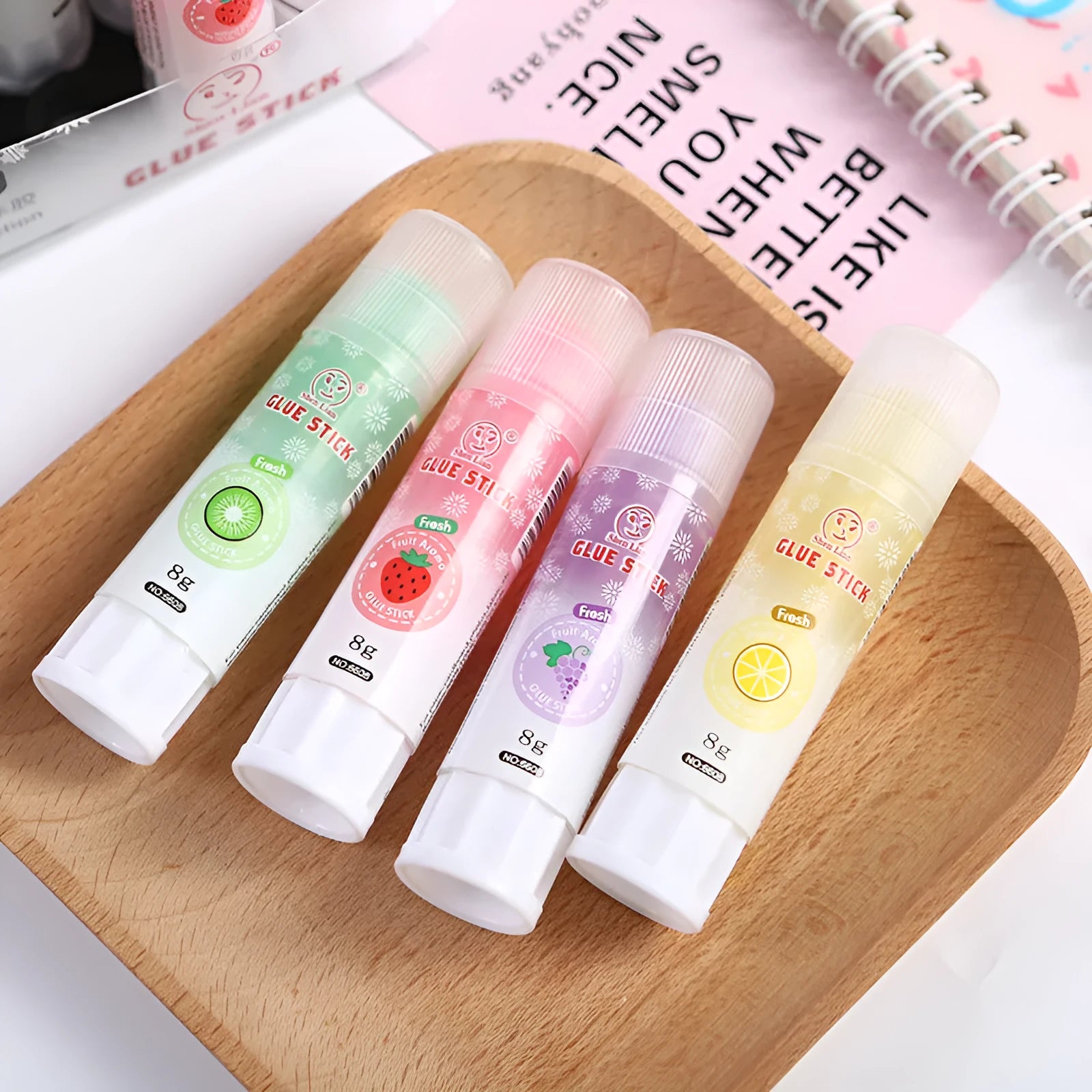 Jelly fruit fragrance solid glue stick in random colour, 8.5cm long, for students and crafts.