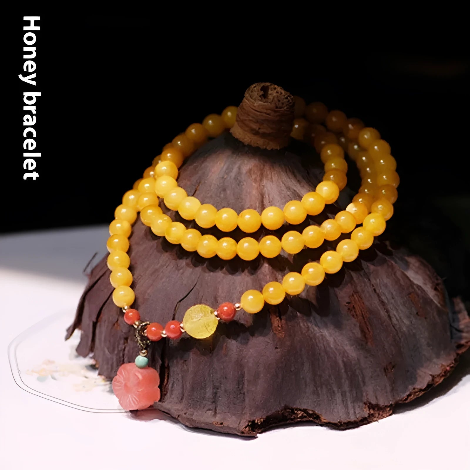 Amber bracelet with carved chicken zodiac charm and 5mm round fantasy crystal elements in retro style