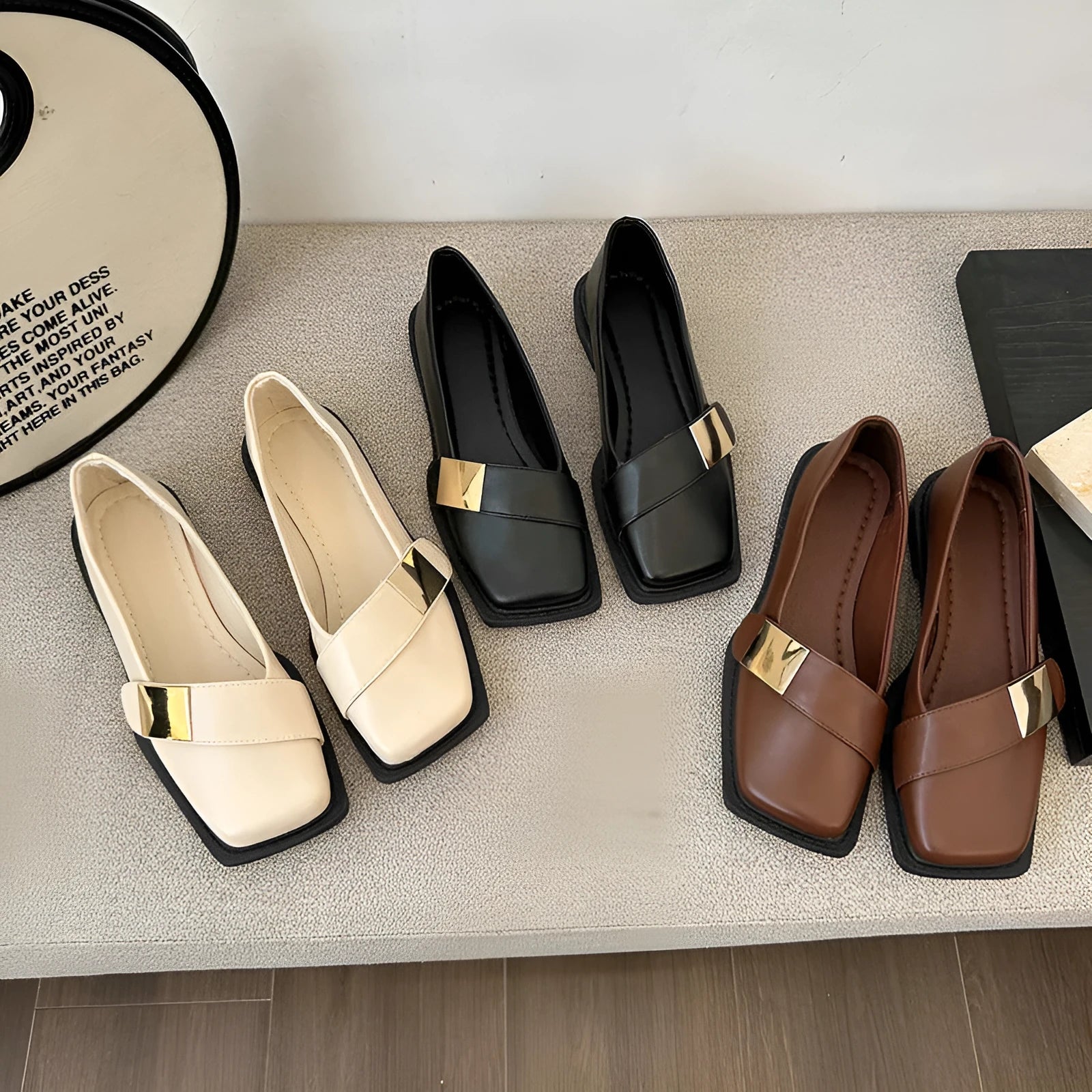 Beige women's square toe flat shoes with a metal buckle and low square heel