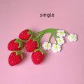 Wool crochet strawberry pendant necklace in pink colour with textured knitting details