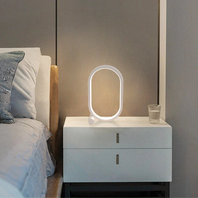 Oval acrylic desk lamp with touch controls, USB charging, and energy-efficient LED lighting