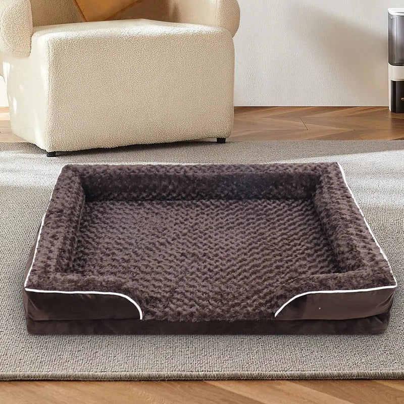 Light grey waterproof dog kennel pad with removable washable cover next to a dog crate.