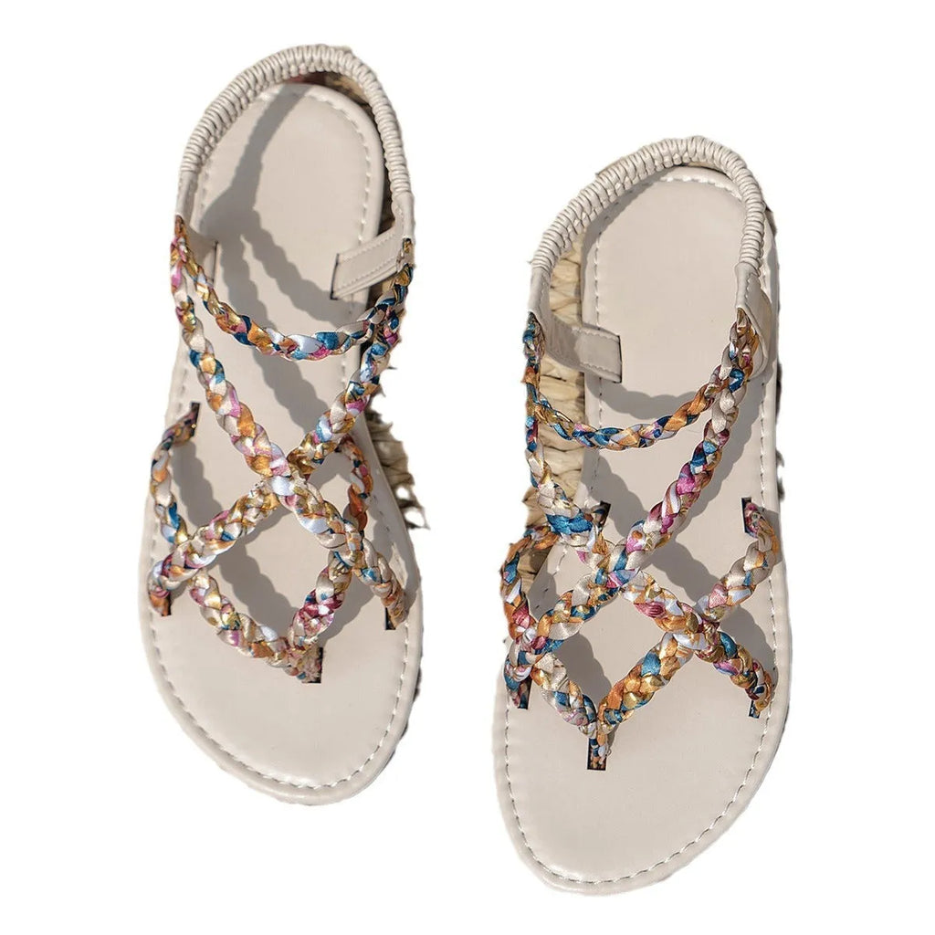 Adult flat sandals with elastic band in black or white, cloth upper, round toe.