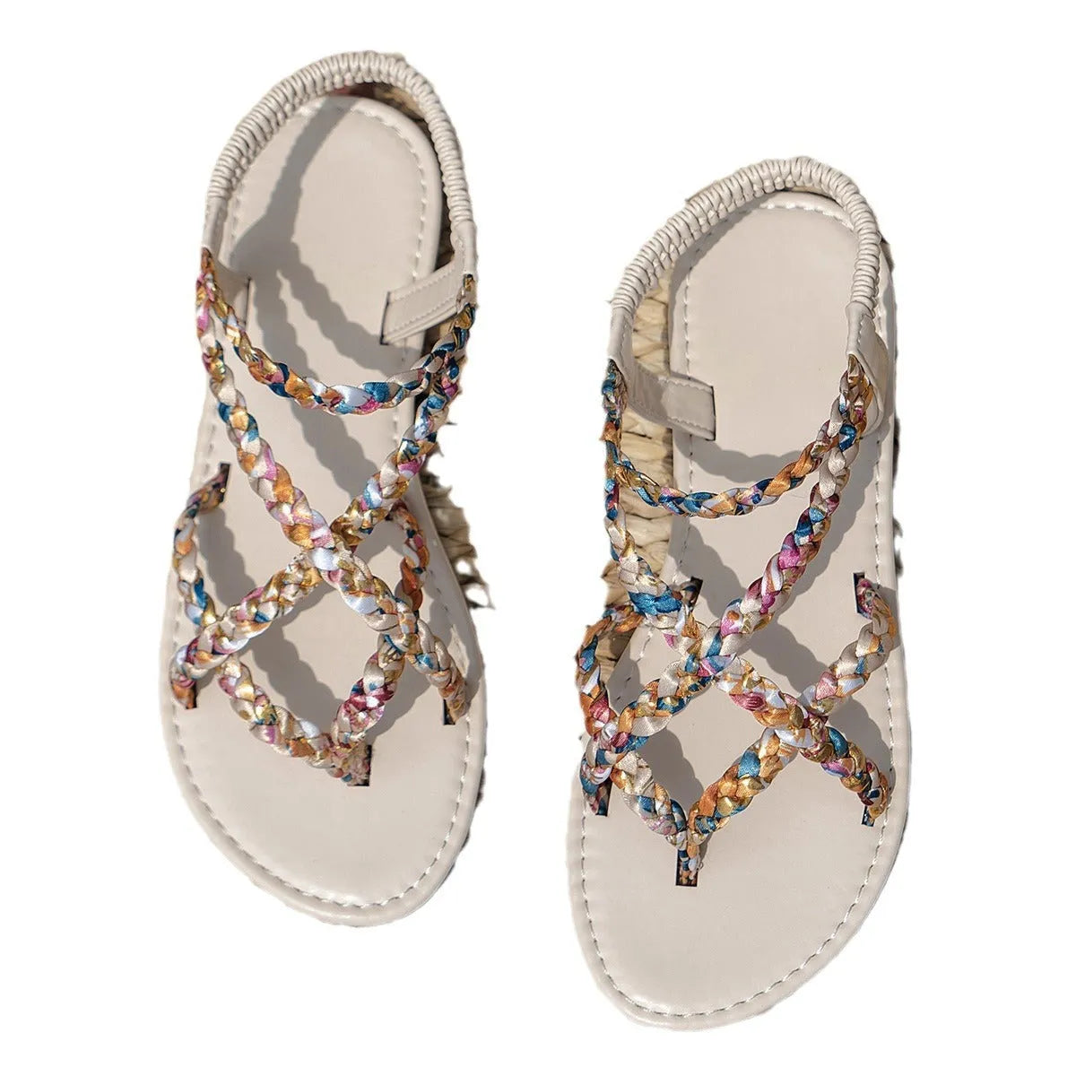 Adult flat sandals with elastic band in black or white, cloth upper, round toe.