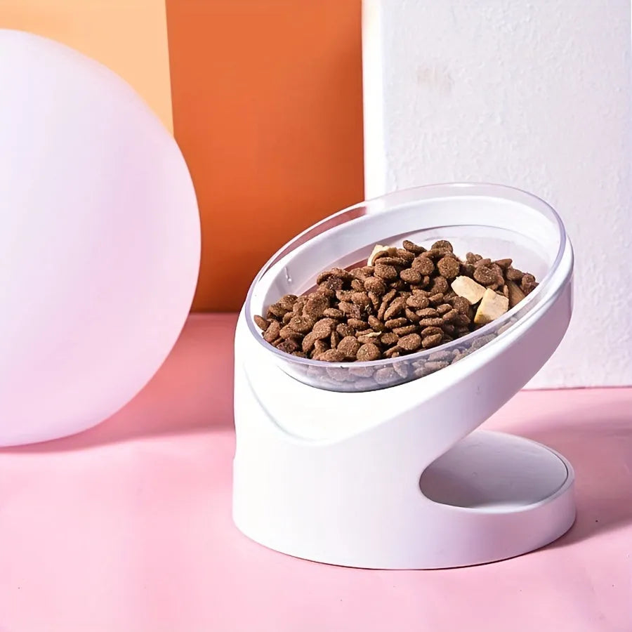 White elevated plastic cat food bowl with a tilted feeding surface for neck protection.