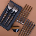 12-piece makeup brush set with wooden handles in a PU storage bag