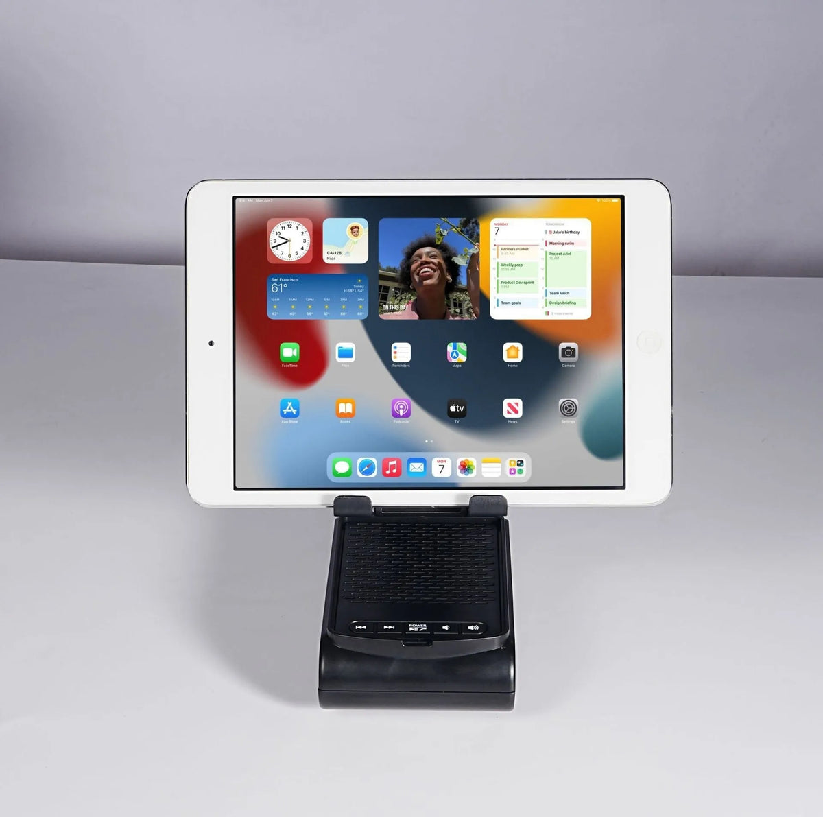Multi-function lazy phone holder with Bluetooth audio speaker in black plastic, USB powered