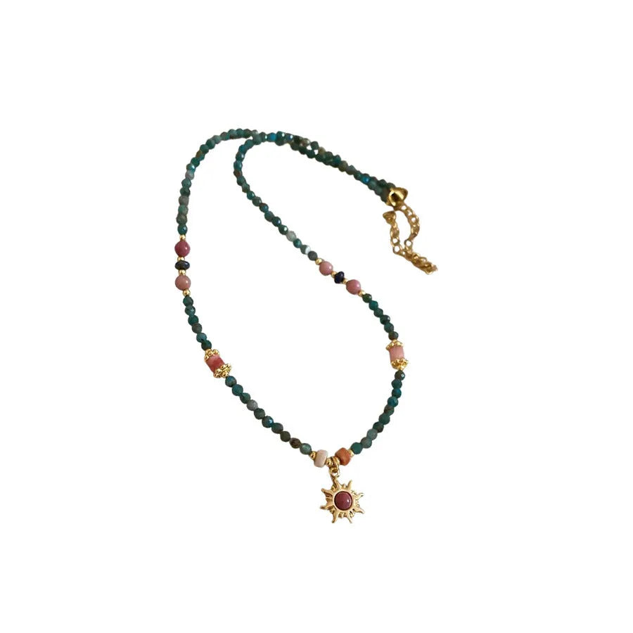 Freshwater pearl necklace with stone sun pendant on clavicle chain, blue or golden pink colour options