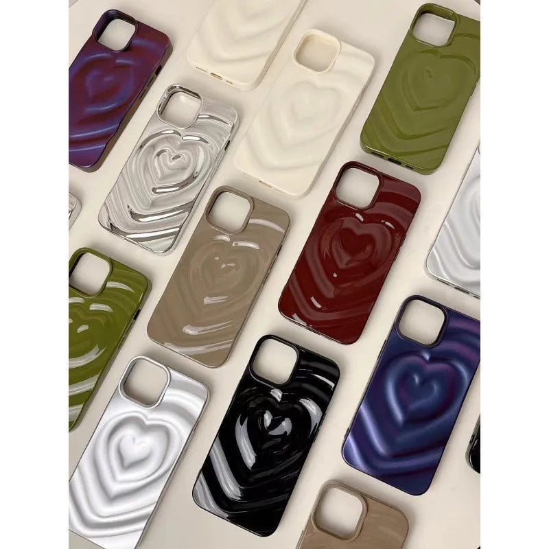 Solid colour iPhone case with a raised 3D love design on the back, shown in bright purple.