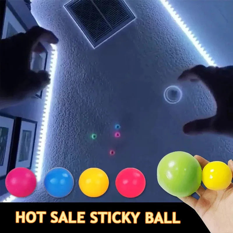 Luminous sticky ball toy in green colour glowing on a dark background, 4.5cm TPR squeeze ball for children