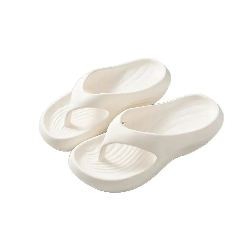 Women's thick-soled flip flops with non-slip textured soles in black, white, and grey colour options