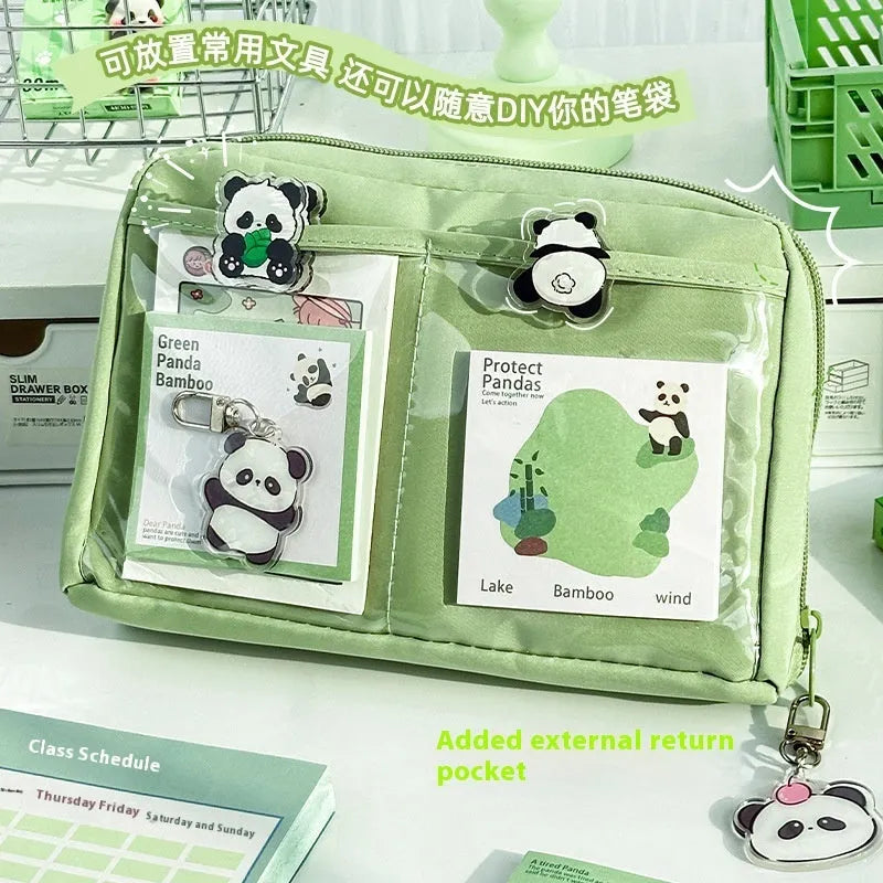 Green canvas pencil case with panda design showing 12-layer compartments open