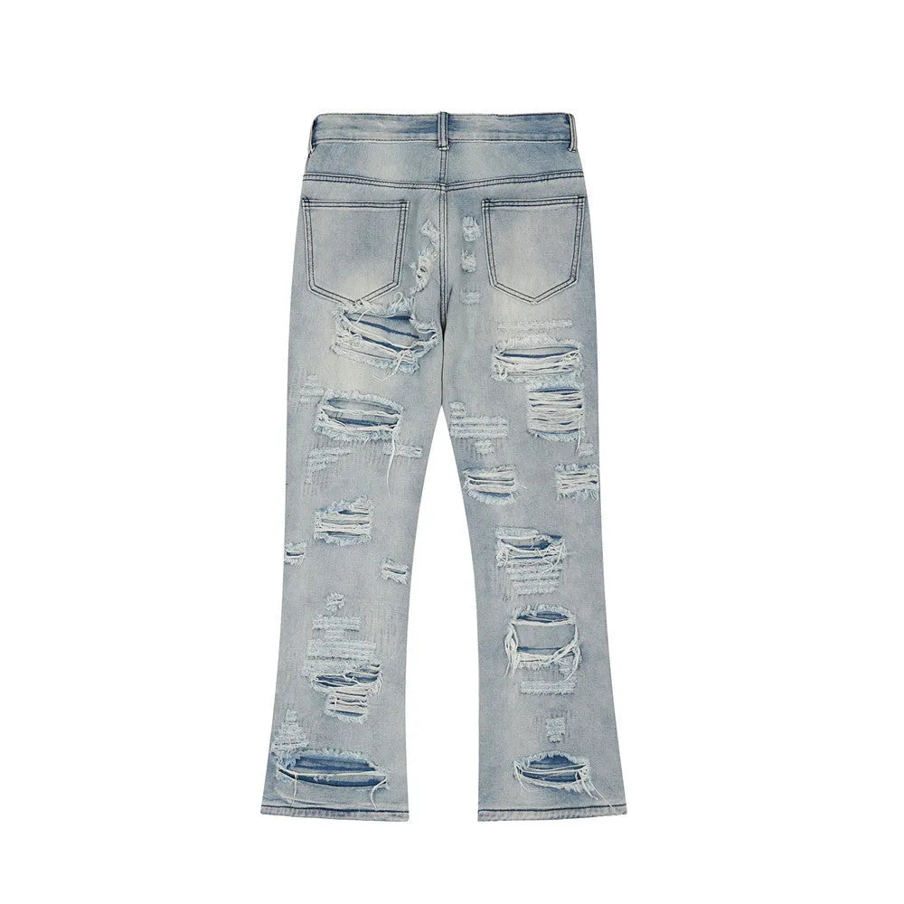 Men's flared washed jeans in light blue denim with zipper fly