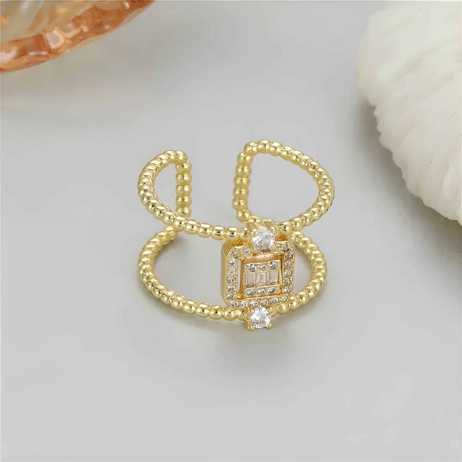 Open ring with adjustable opening in copper gold finish showing U-shaped asymmetrical design
