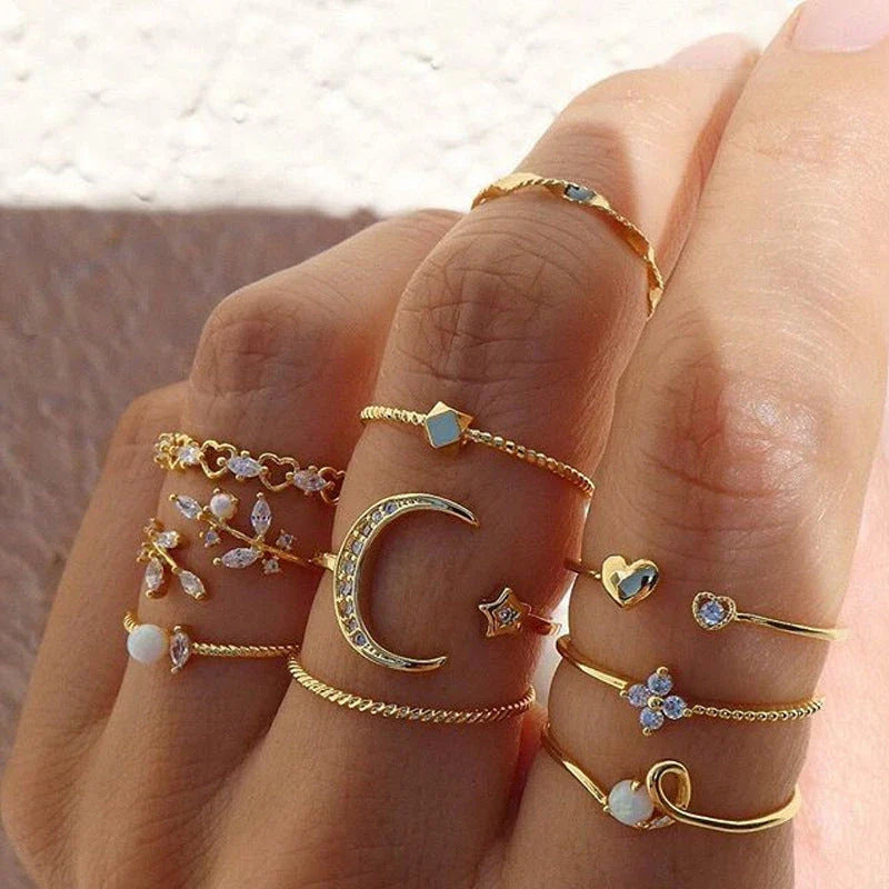 Enchanting gold-plated rings with shimmering moon, star, and pearl accents - a captivating celestial-inspired accessory to elevate your style