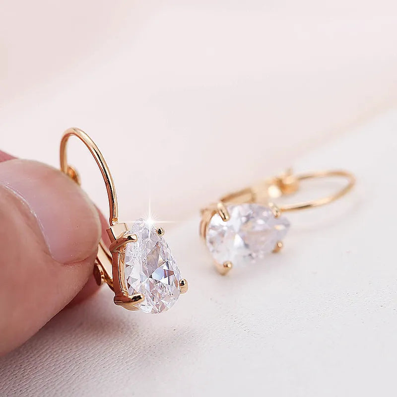 Women's drop-shaped fashion earrings in gold or platinum finish with copper construction