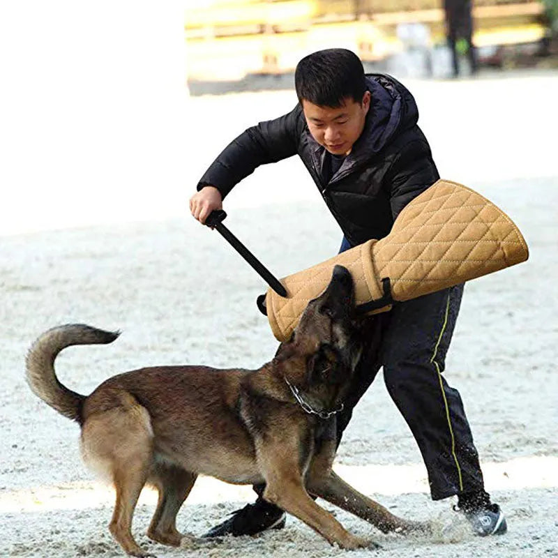 Jute dog bite training sleeve 65 x 28 cm with internal plastic handle, external foam handle, and black side hanging handle.