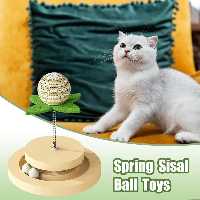 Green sisal cat toy with rotating ball track system for indoor feline play