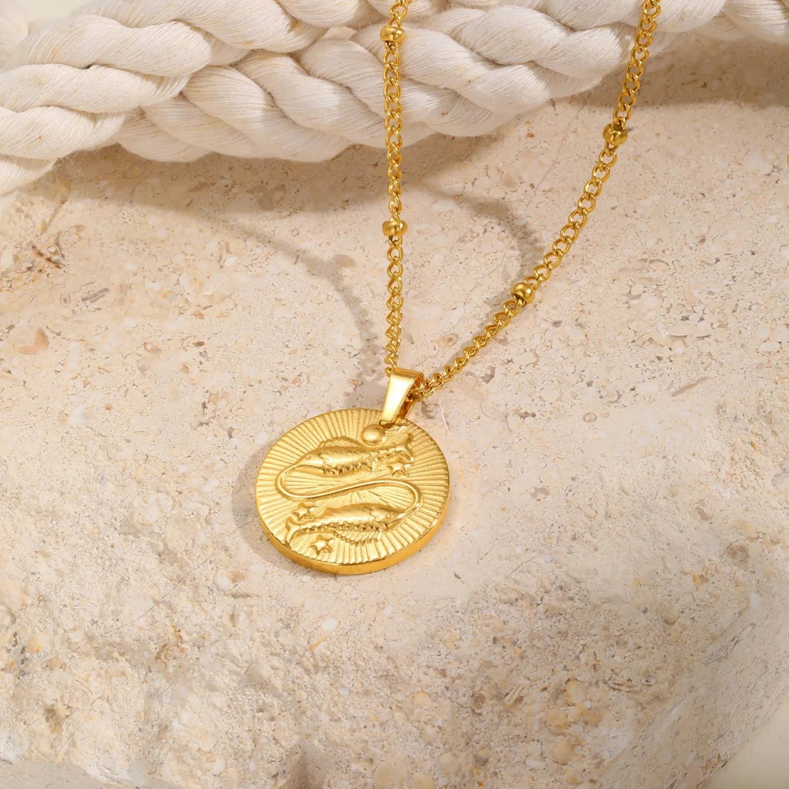 Stainless steel zodiac constellation bead necklace with twelve star signs on round geometric pendants and cross chain