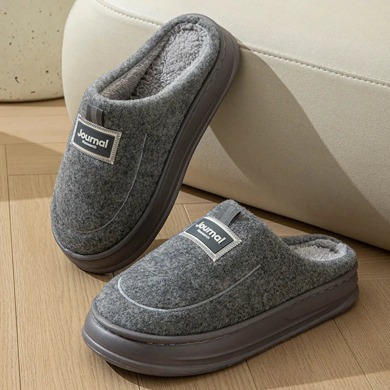 Men's brown thickened cotton slippers with a suede upper and textured sole, shown from the side.