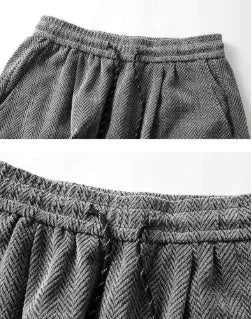 Light grey straight-leg casual trousers with a fleece lining and elastic waistband on a hanger.