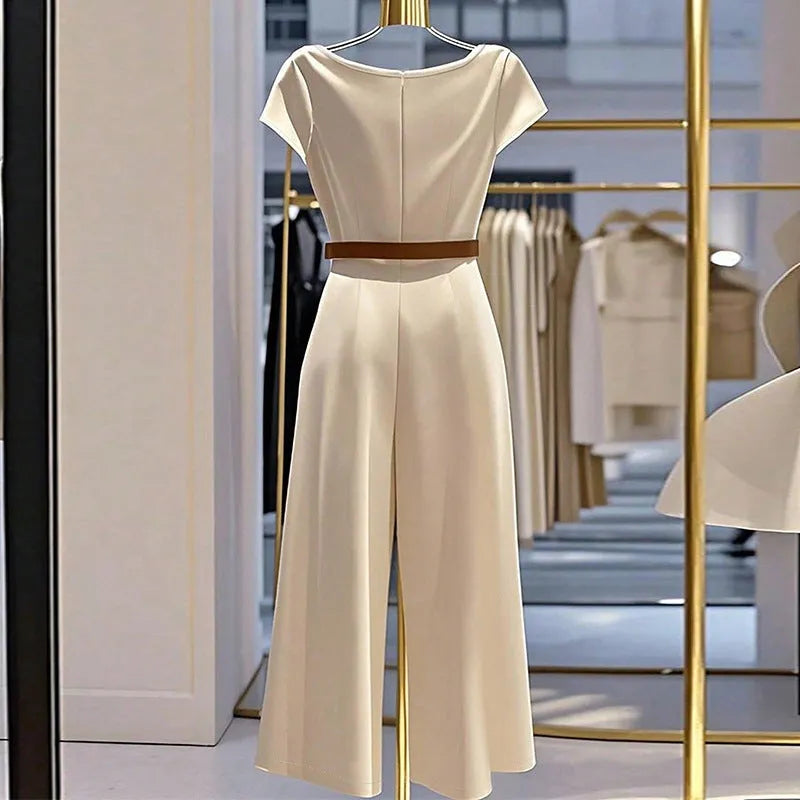 Apricot satin wide-leg jumpsuit with mid-waist and quarter sleeves on a model