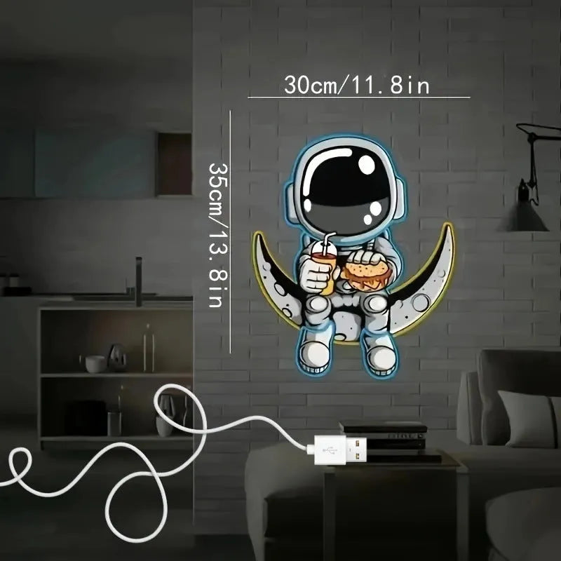 Blue and yellow astronaut and moon LED neon light mounted on a wall.