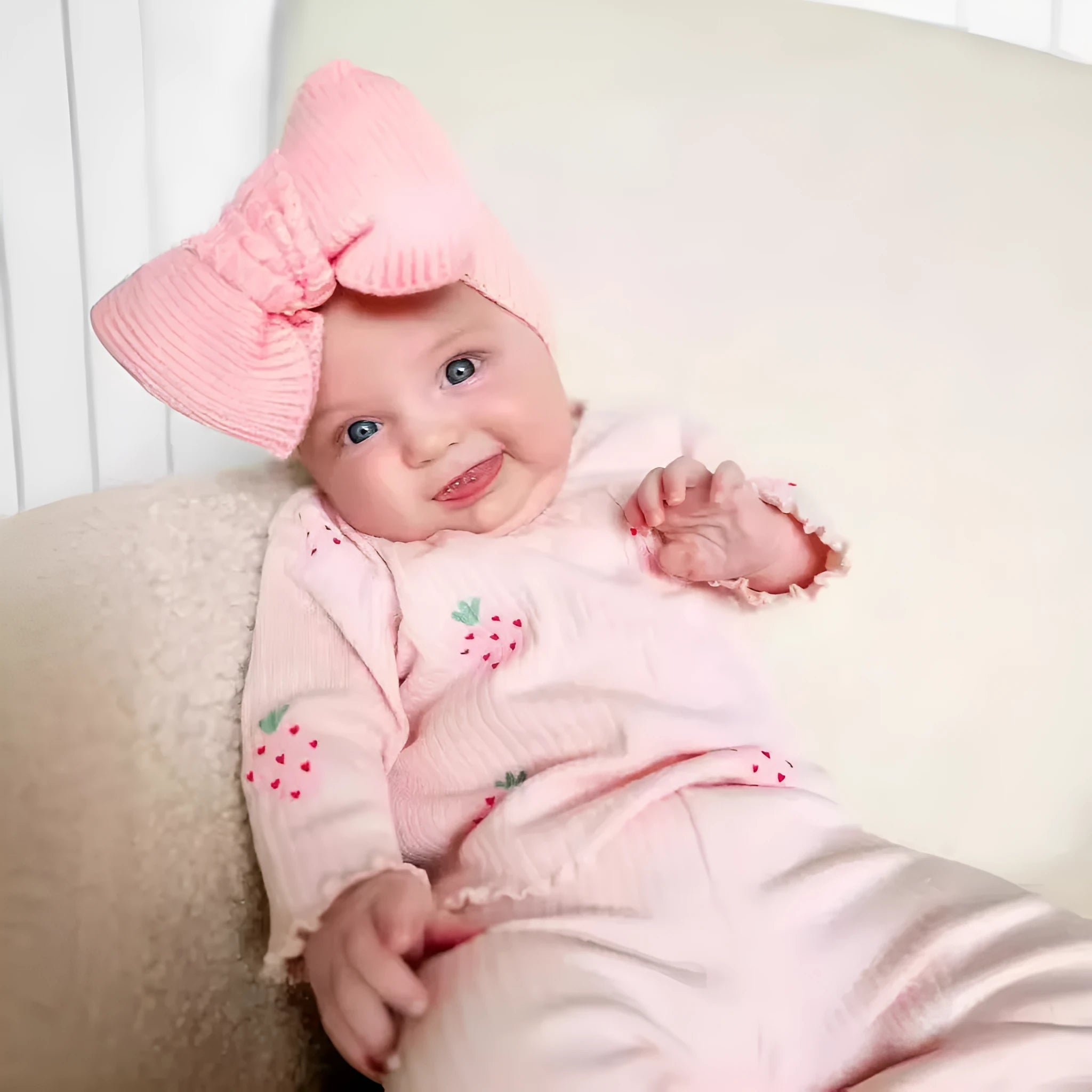 Infant wearing a printed long-sleeve top, solid trousers, and matching cap from the 3-piece suit set.