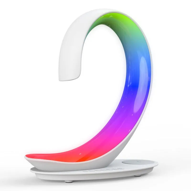 White swan decorative light with wireless charging pad and Bluetooth speaker emitting colourful illumination