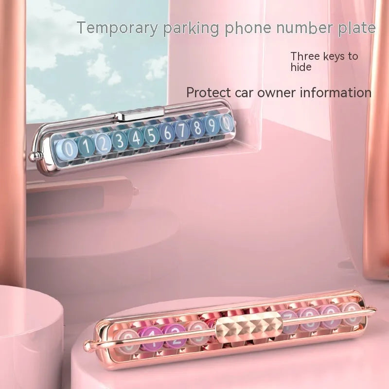Plastic temporary parking number plate showing colour options: pink on gold, blue on silver, and green gradient.