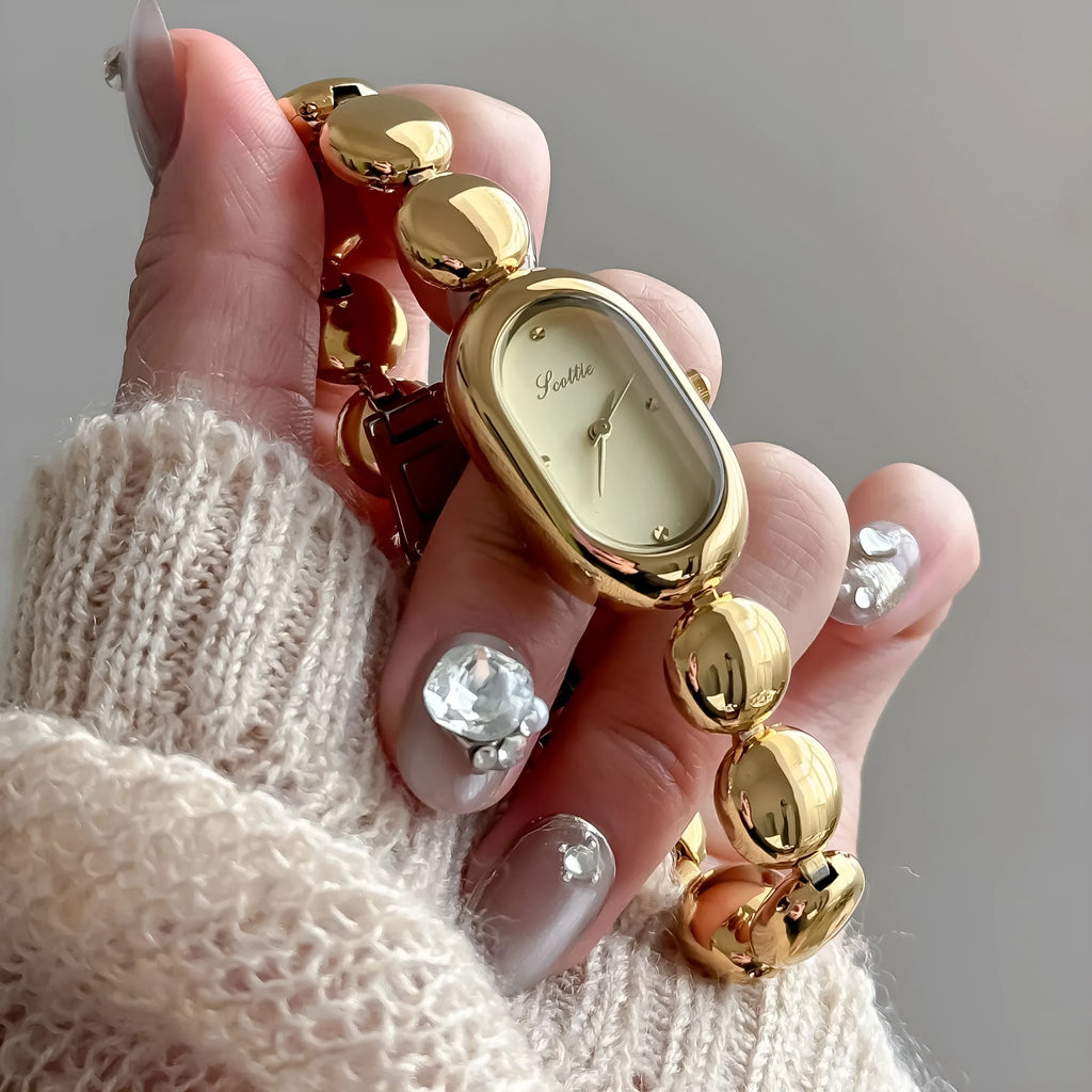 Women's oval dial watch with bracelet strap in multiple colour finishes including gold and platinum options
