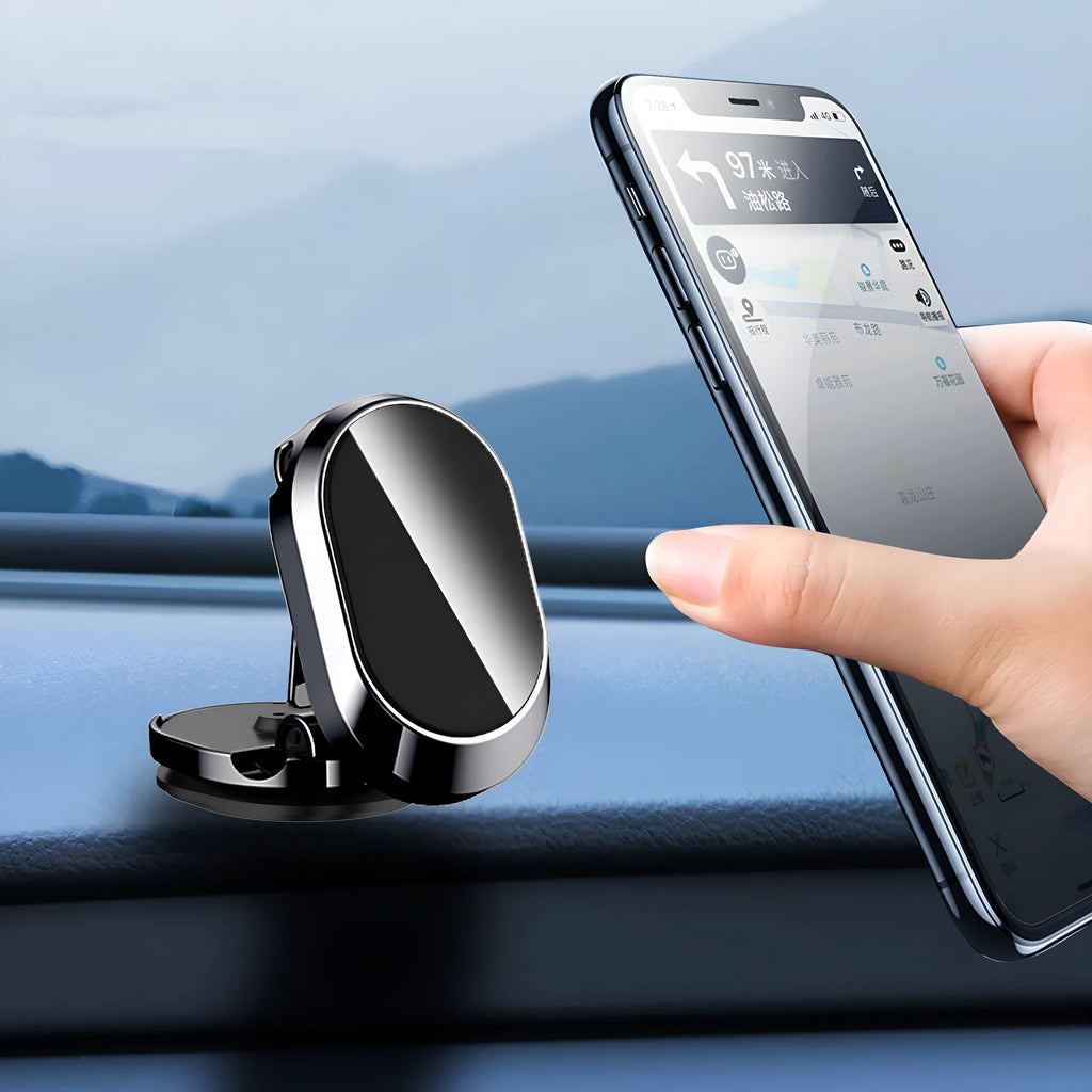Folding magnetic phone holder in black on car dashboard with phone attached