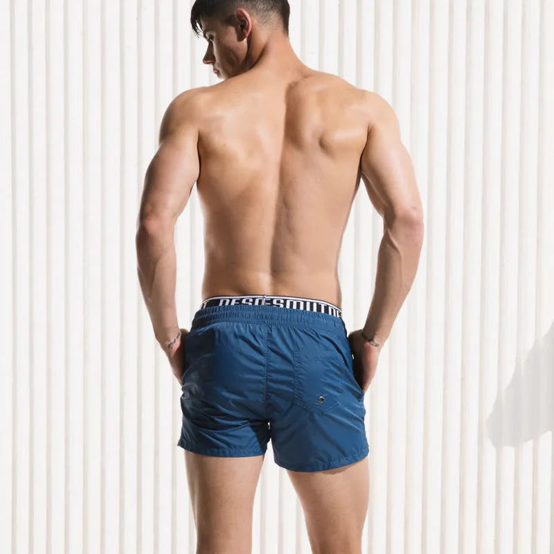 Men's quick-drying nylon beach shorts in yellow, loose fit for running and swimming