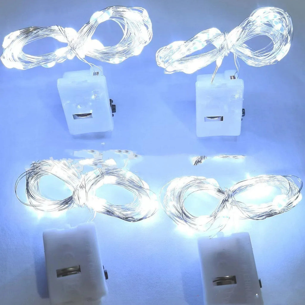 LED copper wire light in small white box with three-gear adjustment and 0.2m chain of four warm white LEDs