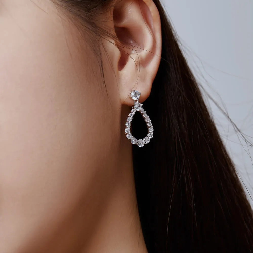 925 silver hollow zircon water drop earrings for women, platinum electroplate finish, 15 x 28.5mm teardrop shape on black background