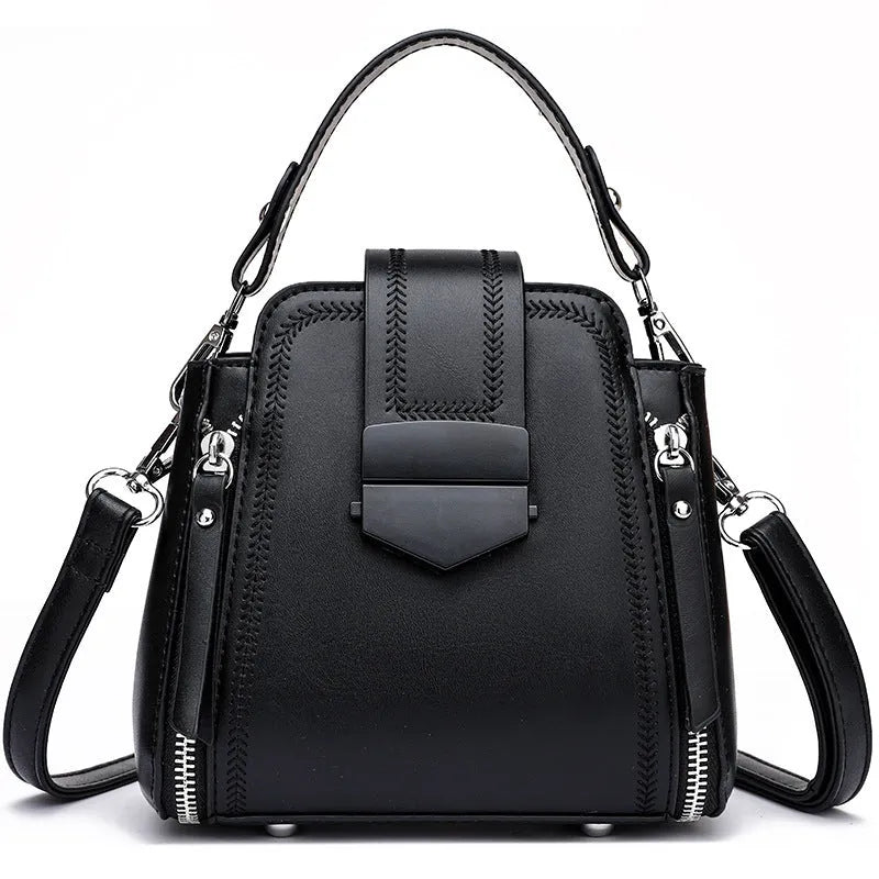 Small square vertical handbag in soft textured PU leather with zip closure and sewing thread detail