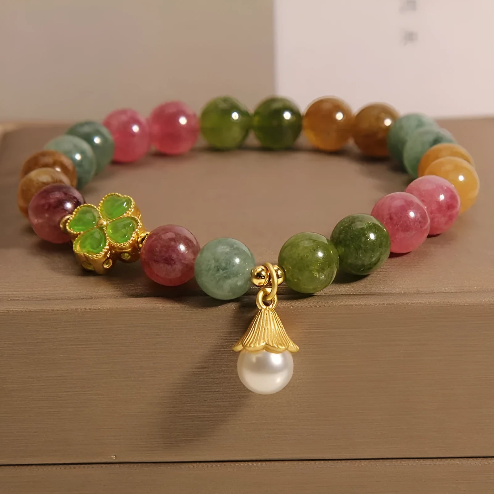 Women's colourful tourmaline bracelet with four-leaf clover charm and pearl pendant geometric design
