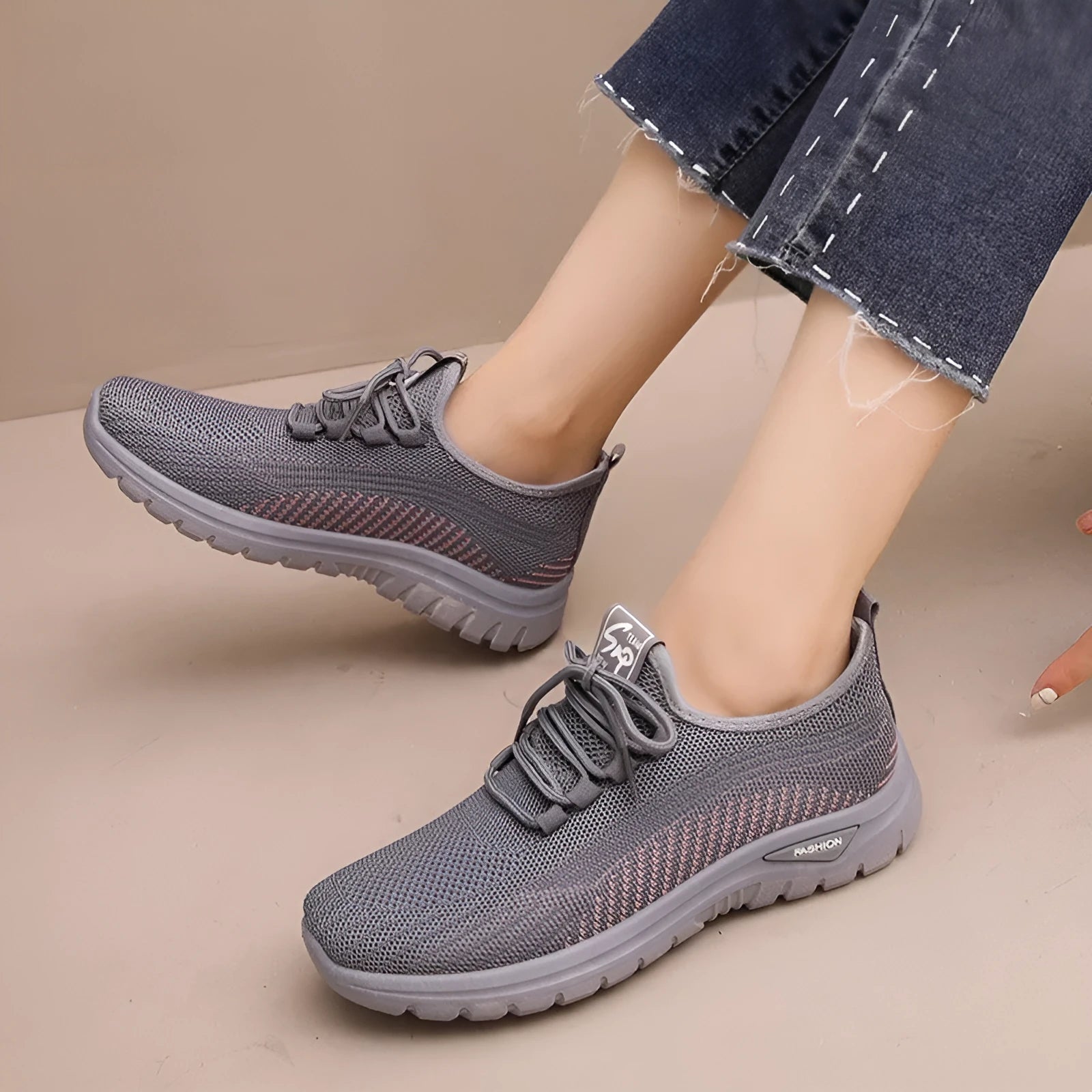 Women's round toe casual sneakers in black with breathable mesh and lace-up front