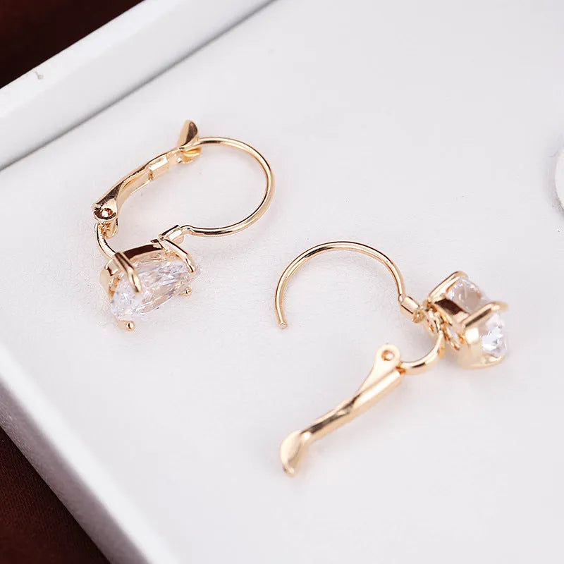Women's drop-shaped fashion earrings in gold or platinum finish with copper construction