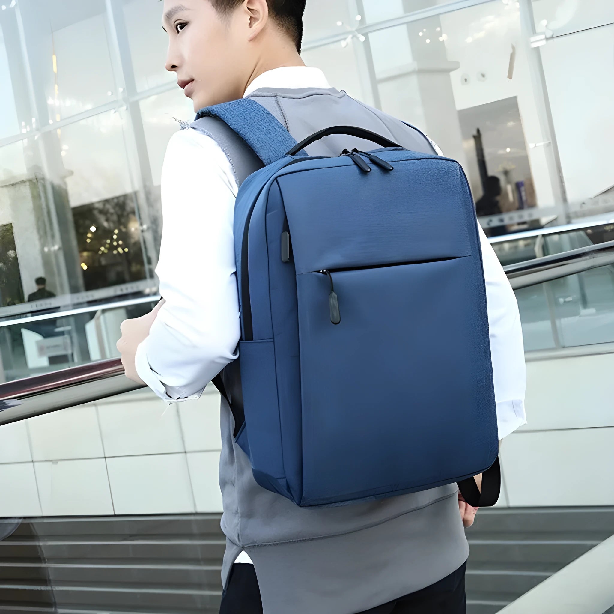 Black sports backpack with USB charging port showing curved shoulder straps and organisational compartments