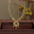 Women's green safety lock bell pendant bracelet with double-layer construction