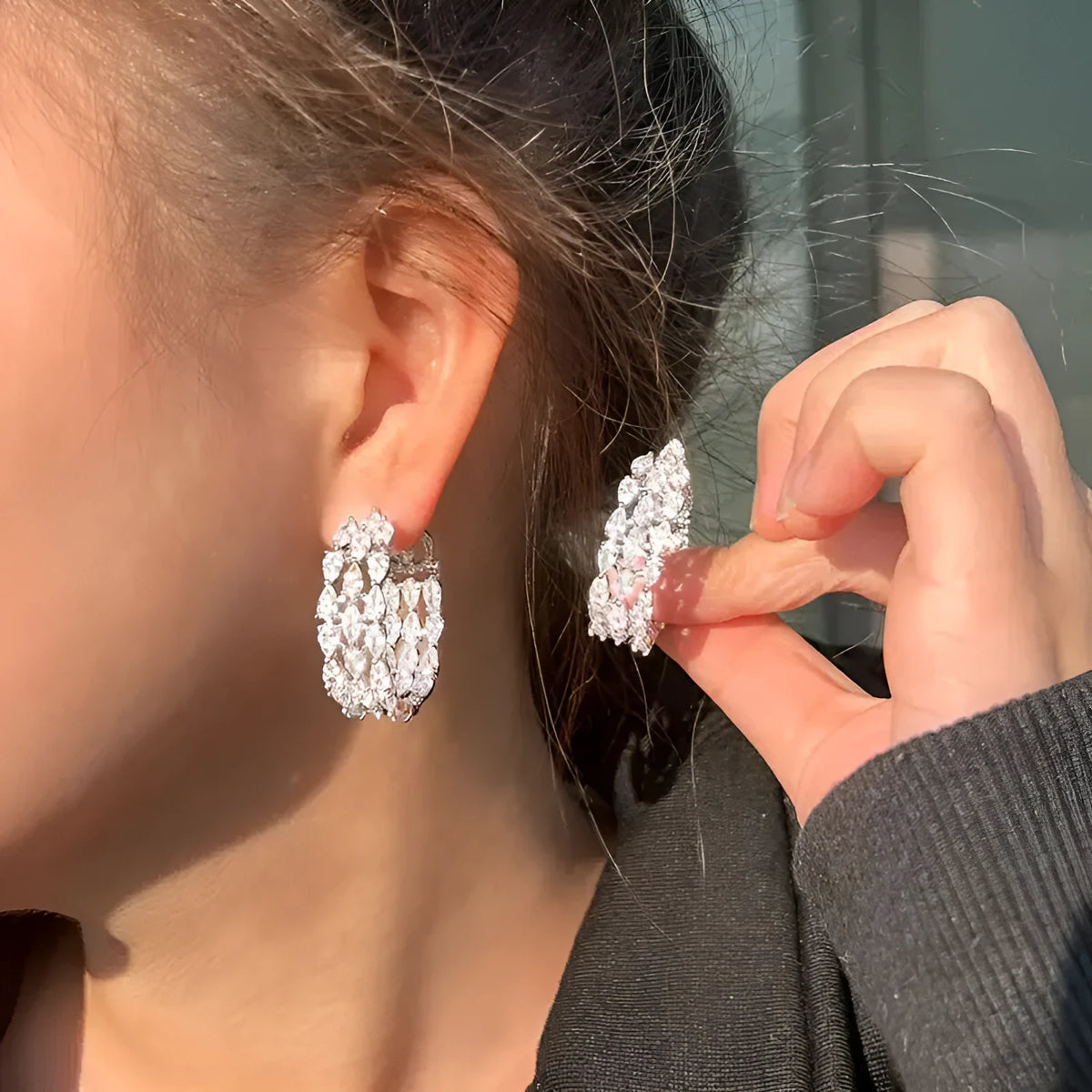 Pair of silver full diamond geometric electroplated copper earrings with threaded winding line design for women.
