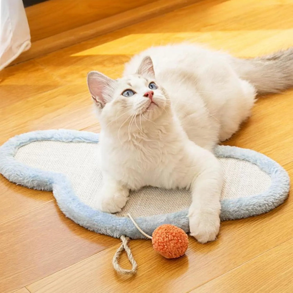 White wall-mounted cat scratching mat with sleeping cat cartoon design on natural sisal material