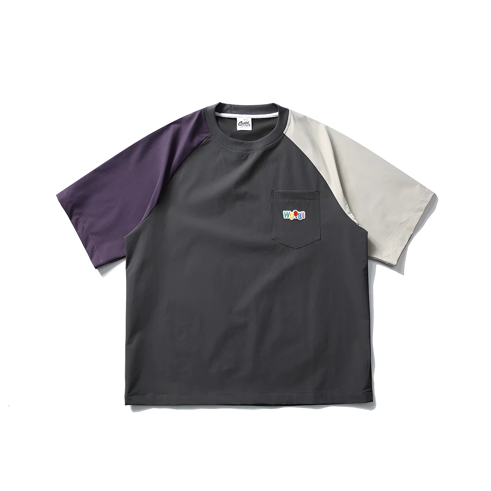 Dark grey loose fit t-shirt with light coloured raglan sleeves on a hanger