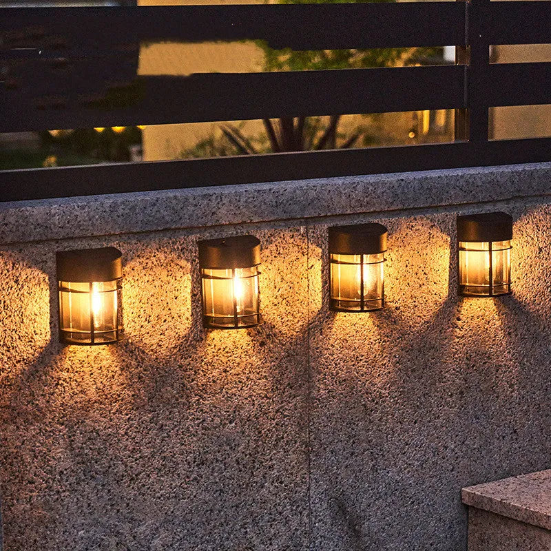Solar-powered outdoor wall light with waterproof housing and warm white illumination